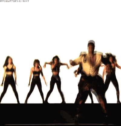 MC Hammer dancing with back up dancers.